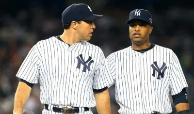 Mark Teixeira y Robison Canó en sus épocas como jugadores de los Yankees. 