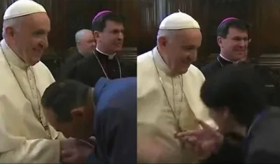 Papa Francisco durante un saludo en que evitó que le besaran el anillo.