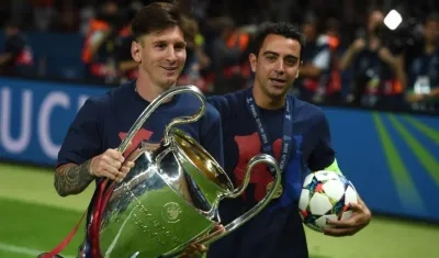 Lionel Messi y Xavi Hernández. 