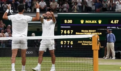 Juan Sebastián Cabal y Robetr Farah celebran tras el título. 