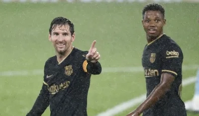 Lionel Messi y Ansu Fati.