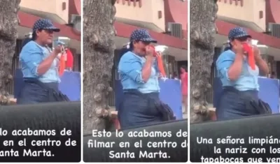 La mujer limpiándose la nariz.