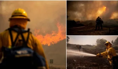 Bomberos tratan de controlar el fuego en Los Ángeles.