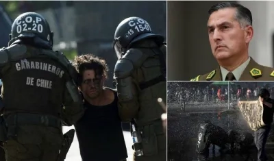 Carabineros detienen hoy a un manifestante durante una protesta junto al Palacio de La Moneda, en Santiago (Chile).