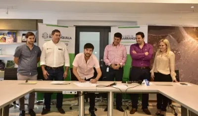 La firma del convenio. 