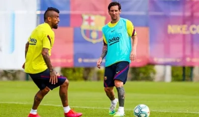 Arturo Vidal y Lionel Messi.