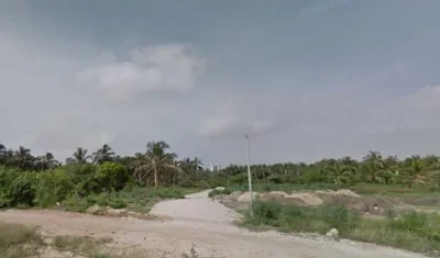 En este sector de La Loma, al fondo, fueron hallados los cuerpos en una vivienda.