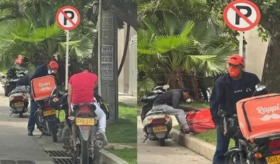 Domiciliarios parqueados en zona prohibida.