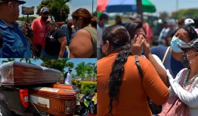 Familiares de reos esperan hoy con féretros en las afueras de la morgue.