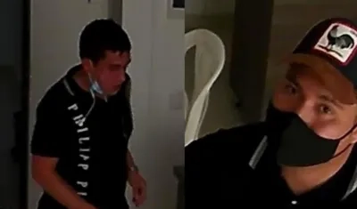 Dos hombres tras ingresar al apartamento.