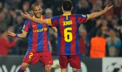 Dani Alves y Xavi Hernández.