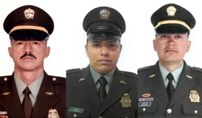 Los tres policías fallecidos. 