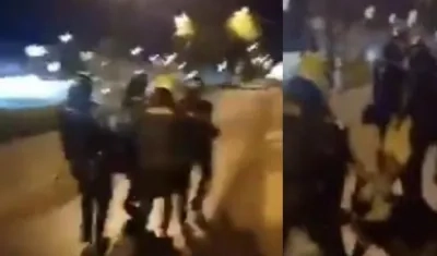 Momentos en que cuatro policías cargan a la menor que se suicidó el jueves en Popayán.