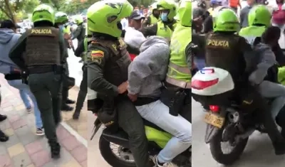 La Policía cuando capturaba a uno de los presuntos implicados en el crimen.