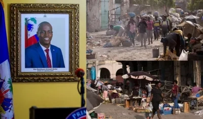 Personas transitan por una avenida del centro de ciudad, en Puerto Príncipe (Haití).