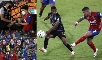 Hinchas en los estadios para ver jugar al DIM y a Águilas Doradas. A la derecha, Adrian Arregui (d) disputa el balón con Jesús Rivas (i). 