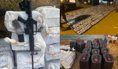 Droga decomisada y el fusil hallado en la embarcación. 