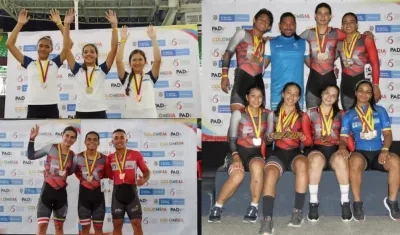 Corredores del Atlántico enseñando su cosecha de medallas. 