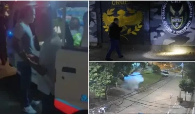 Una ambulancia atiende la emergencia por el estallido de un artefacto explosivo a las afueras de una cárcel en Cali.