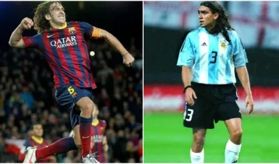 Carles Puyol y Juan Pablo Sorín. 
