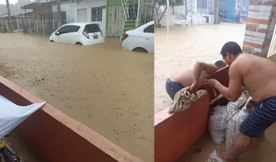 Habitantes tratando de evacuar las aguas de sus viviendas.