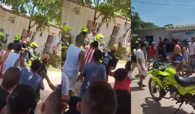 Policía intenta proteger a Enrique Jiménez de la comunidad.