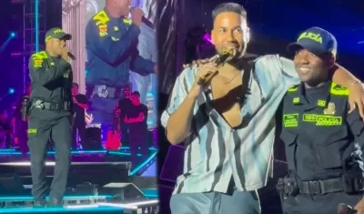 Policía cantando con Romeo Santos en el Atanasio Girardot.