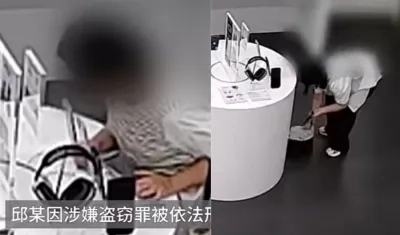 Mujer en el establecimiento robando el teléfono. 