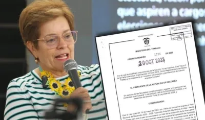 La ministra de Trabajo, Gloria Ramírez, enseña el decreto 1736 del 20 de octubre