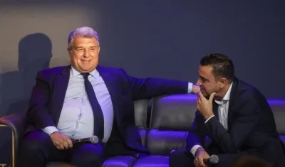 Joan Laporta y Xavi Hernández.