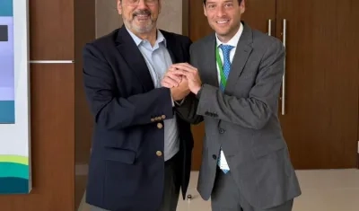 Sergio Díaz-Granados, presidente del CAF, y el senador Mauricio Gómez. 