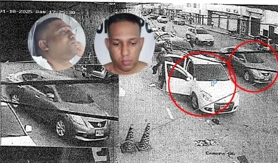 Taxi parqueado en la carrera 38 antes que se bajara el sicario y el momento en que pasa el vehículo donde se transportaba los hermanos Frías Castillo (caras). 