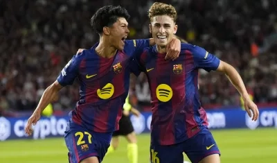 Fermin López (derecha) celebra con su compañero Dro Fernández. 