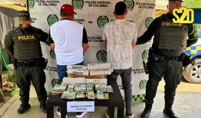 Los capturados y el dinero incautado.