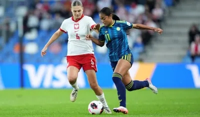 La colombiana Maithe López avanza ante la marca de Magda Piekarska.
