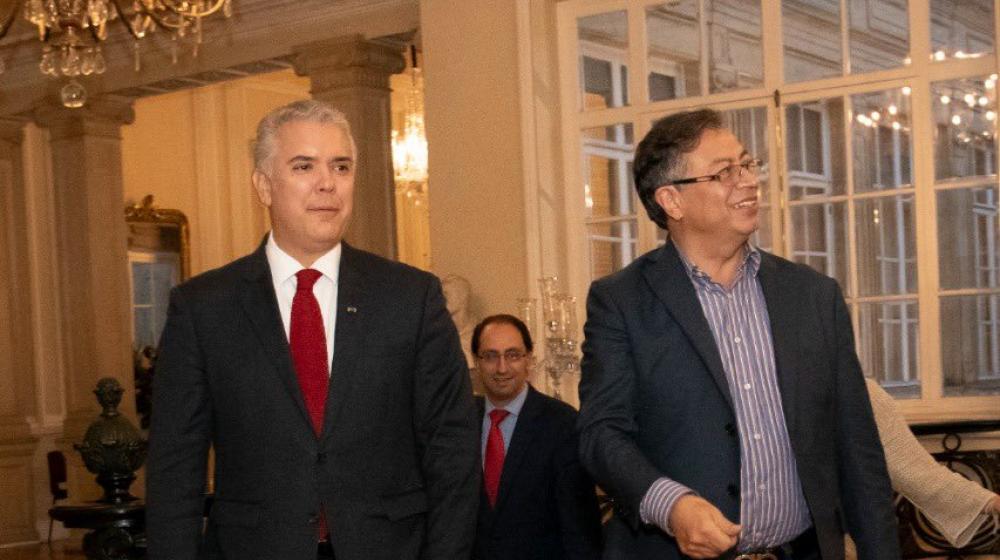 El Presidente saliente, Iván Duque, y el electo, Gustavo Petro.